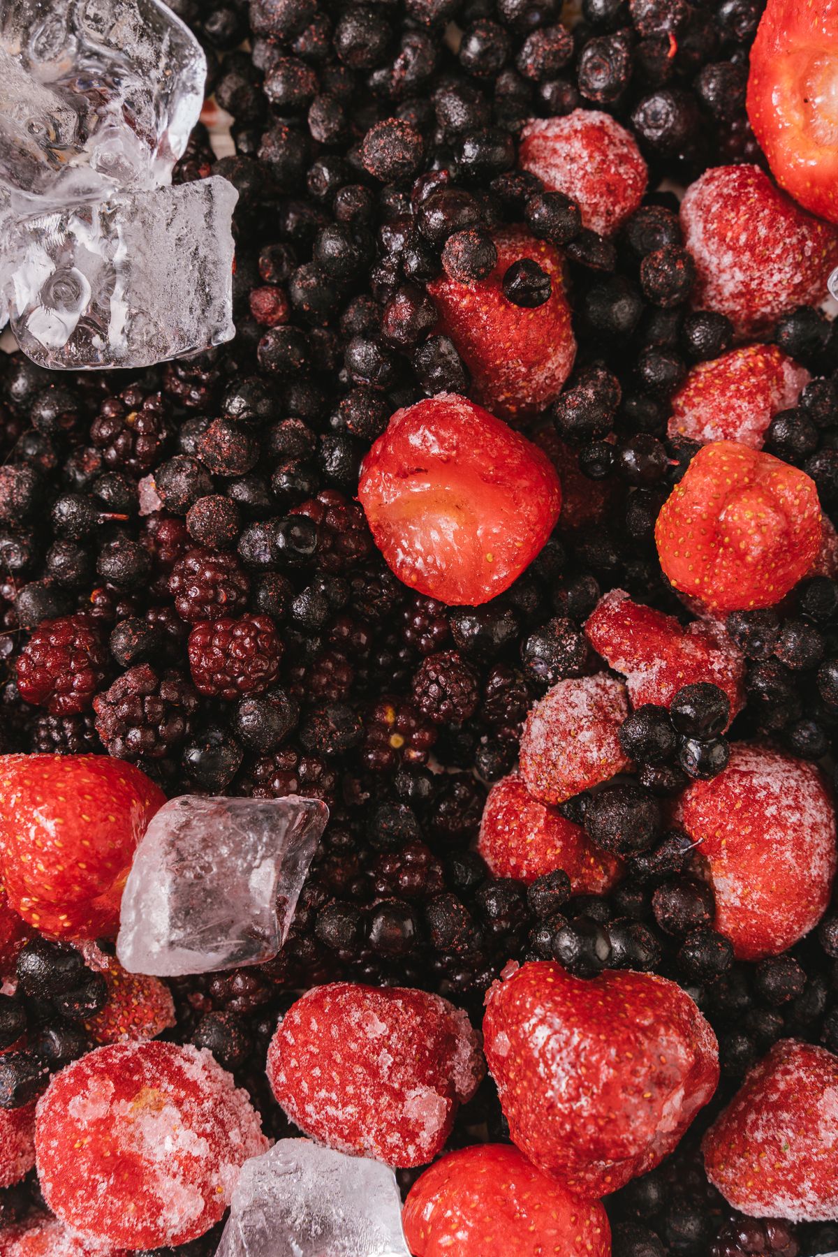 Mixed berries with ice cubes