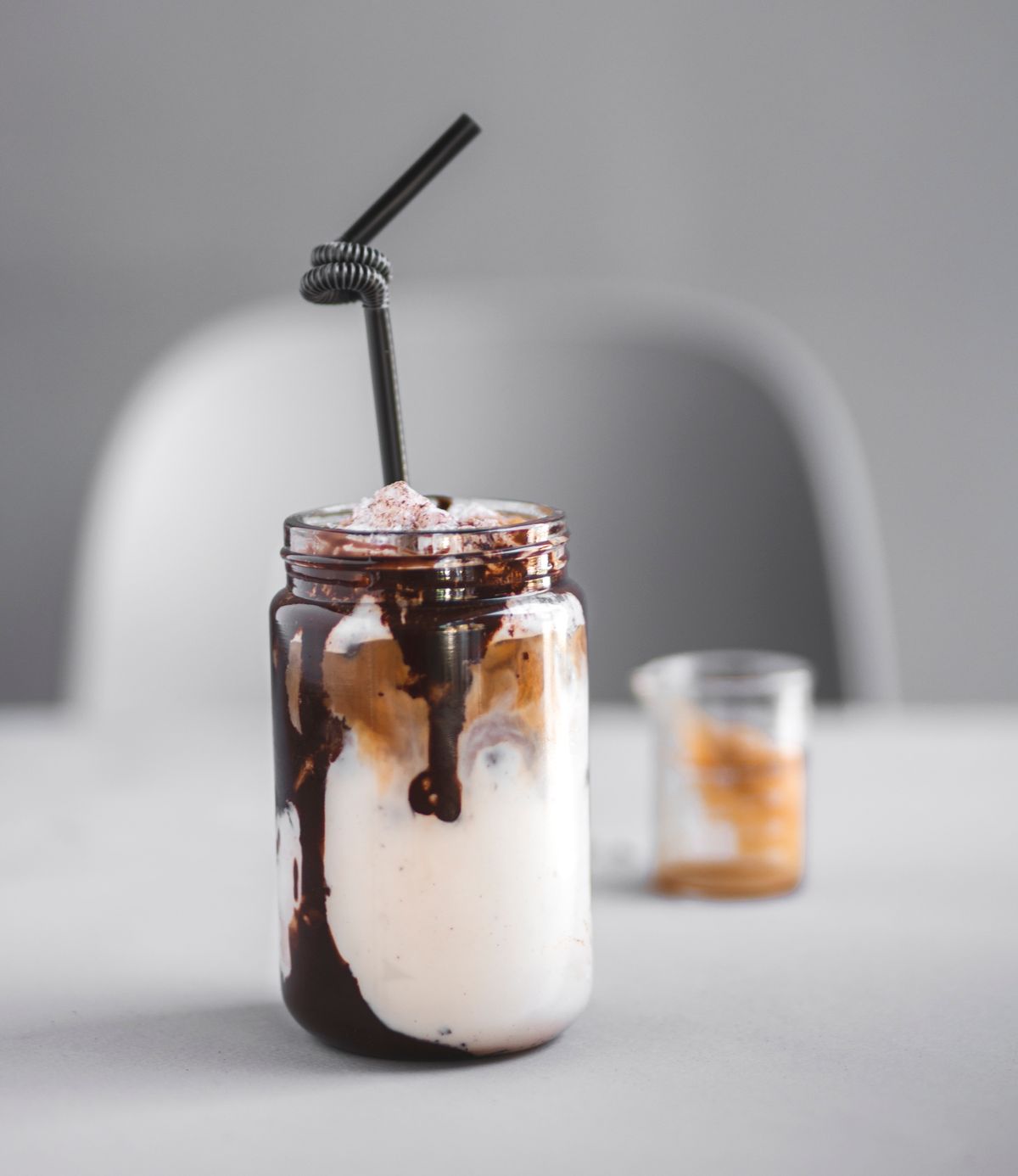 Iced mocha in a jar with chocolate drizzle