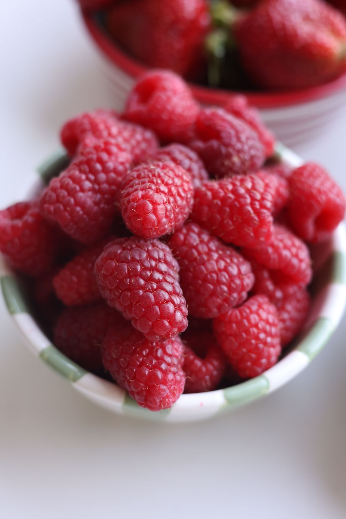 Red raspberries in a small bowl