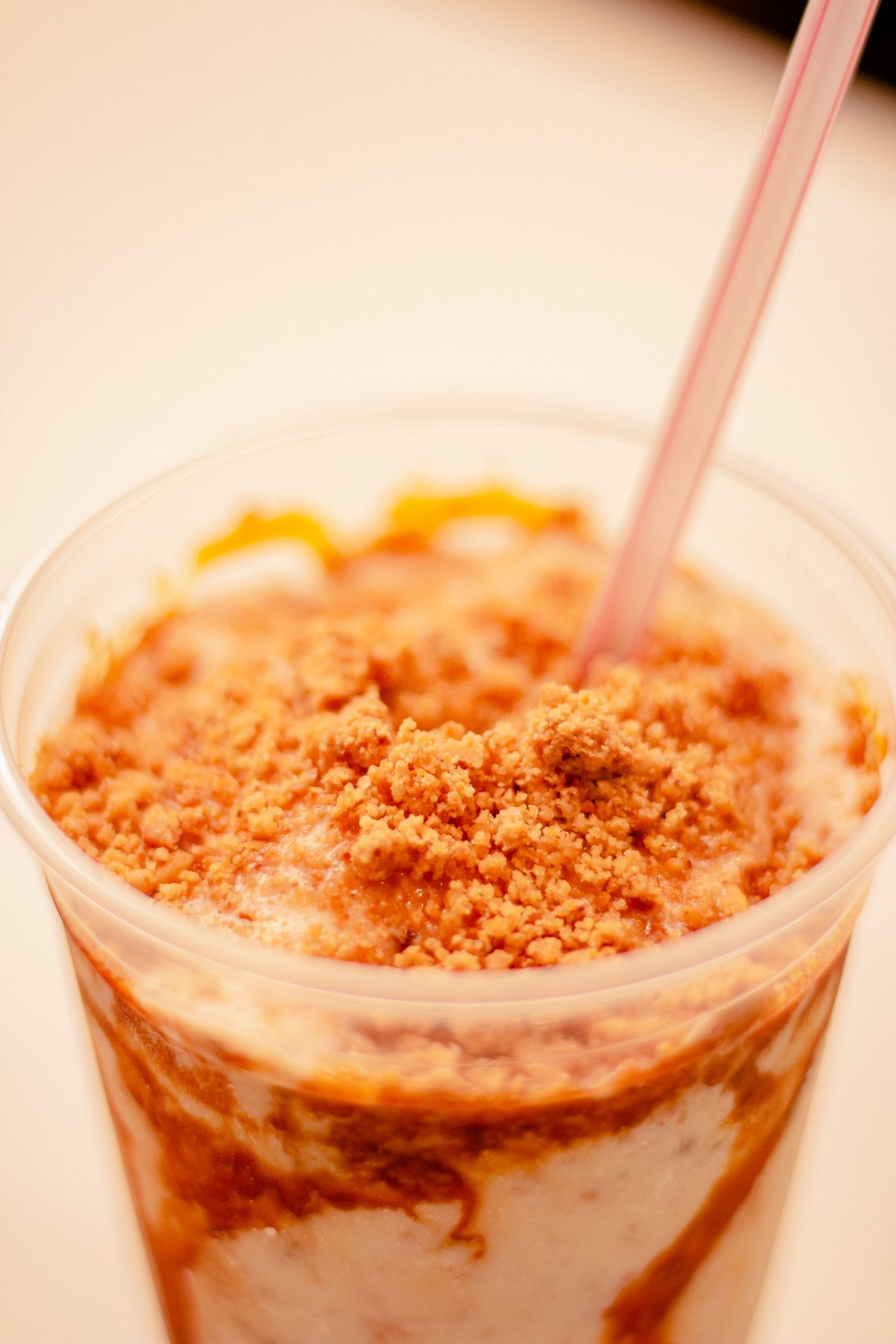 Peanut butter milkshake topped with peanut crumbles