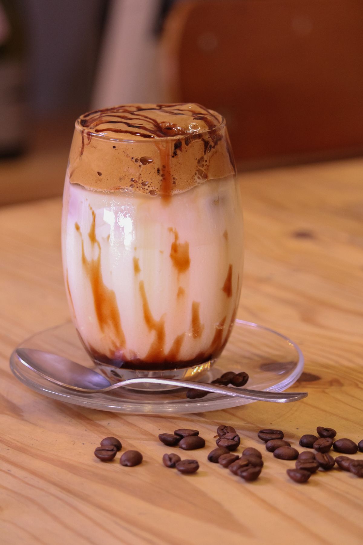 Iced caramel coffee with cream and caramel drizzle